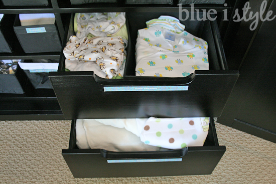 armoire drawers hold baby clothes and supplies