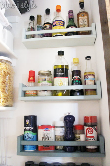 Spice and oil storage on pantry wall