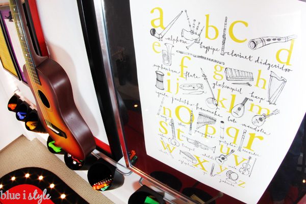 I love the music alphabet poster on rock & roll gallery wall in this playroom.