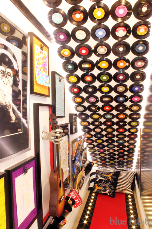 Record feature wall in under stair playroom