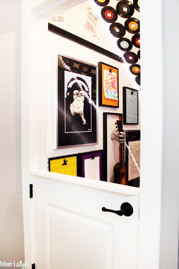 Music themed under stairs playroom with DIY dutch door