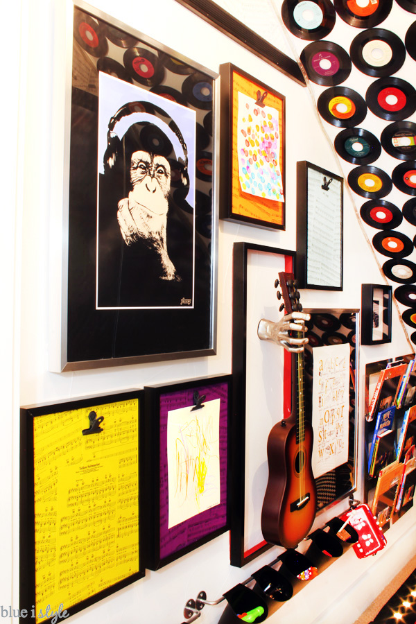 Rock & Roll under stairs playroom with a music gallery wall.