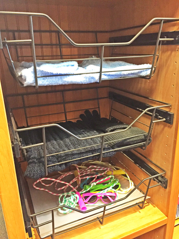 Custom closet with chrome baskets