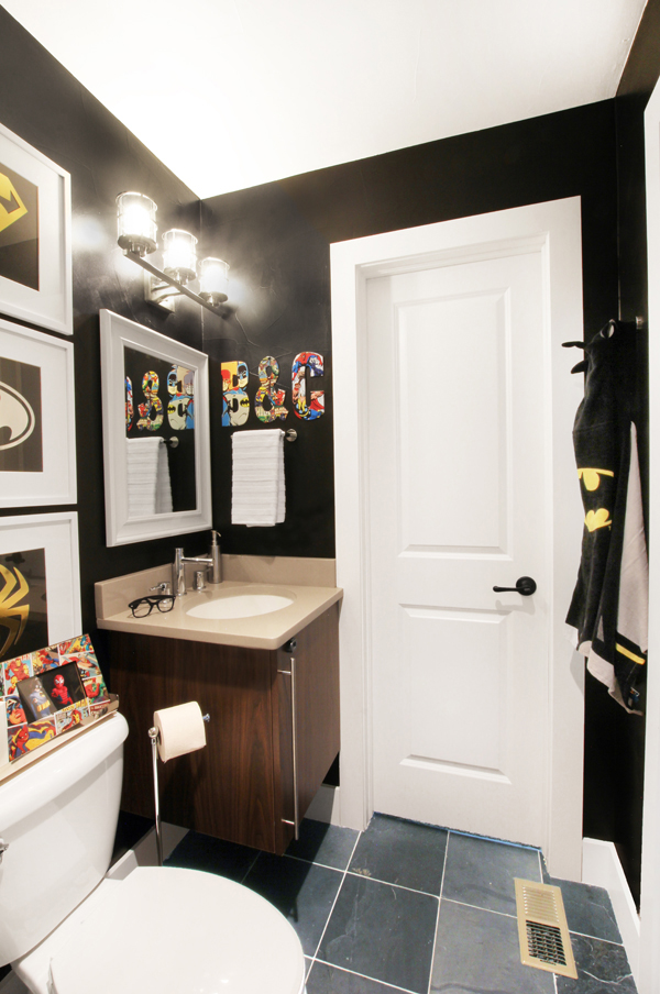 Sophisticated Superhero Bathroom with Black Walls
