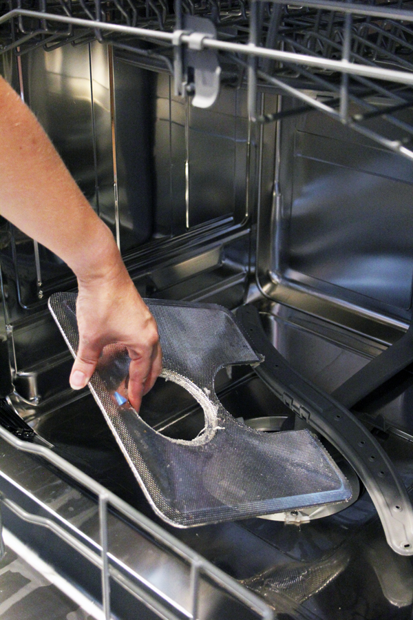 Remove dishwasher drain cover