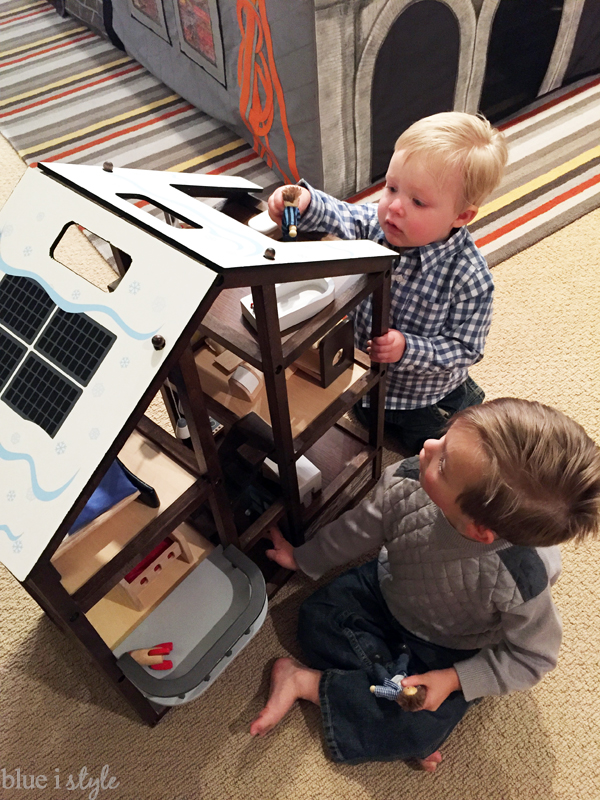 Boys playing with customized Hape All Seasons Dollhouse