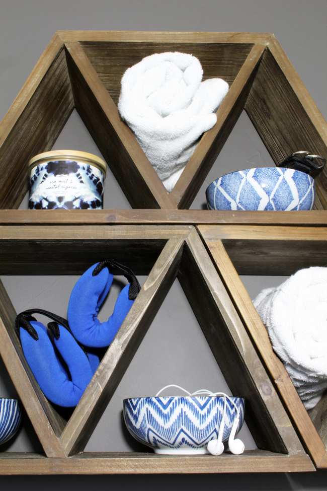 Triangle wood shelves with blue and white porcelain bowls for jewelry