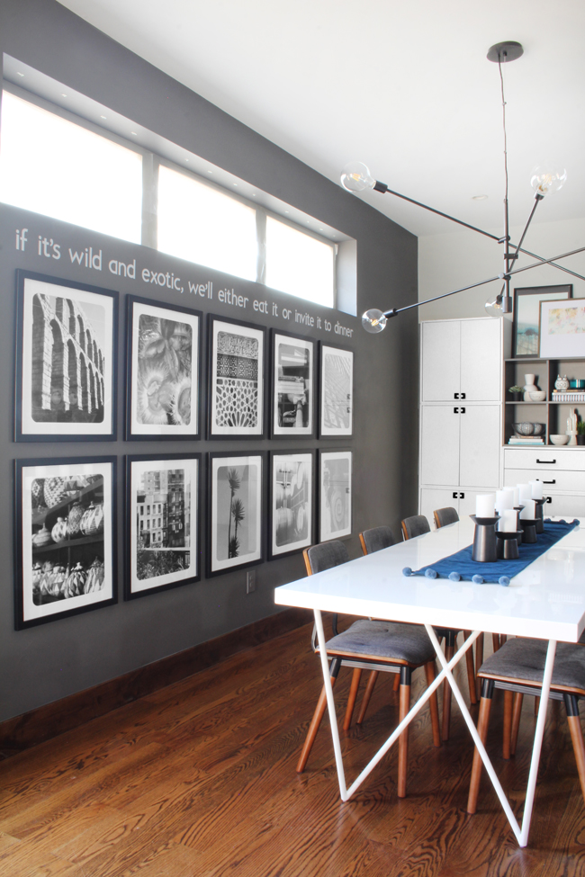 dark gray dining room walls, black and white photo gallery wall, West Elm Mobile Grand Chandelier, White Dylan Dining Table