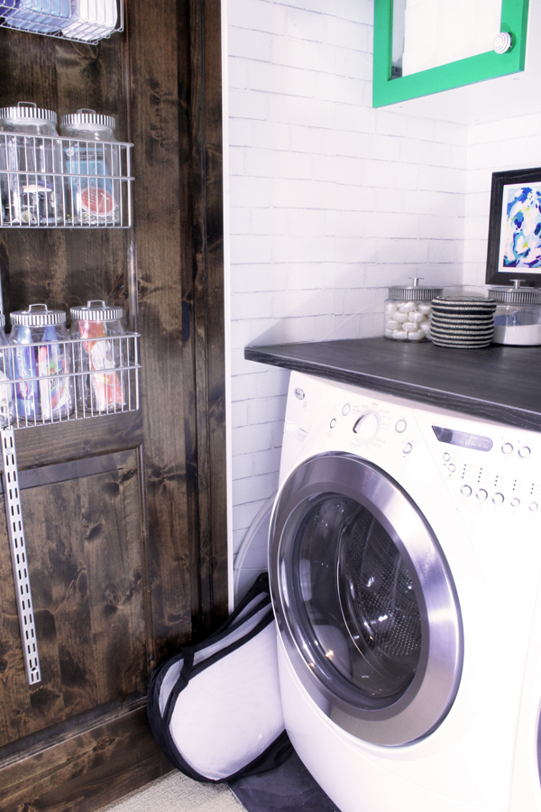 Folding laundry basket slides next to washing machine