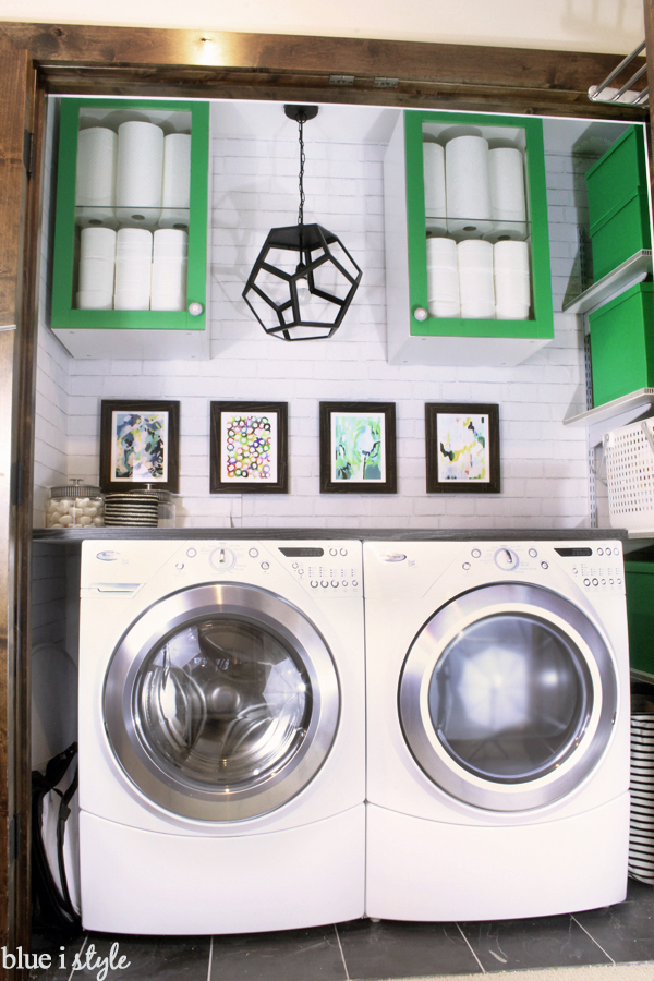 Laundry closet with Ikea cabinets and white brick wallpaper