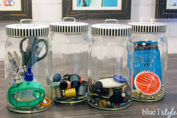 store extra buttons and sewing kits in glass canisters