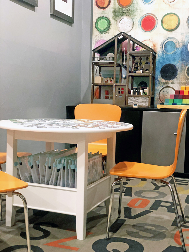 Storing puzzles under a play table