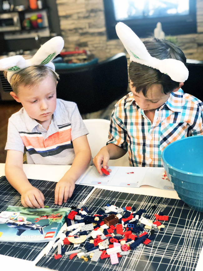 Building the legos they found in their Easter eggs