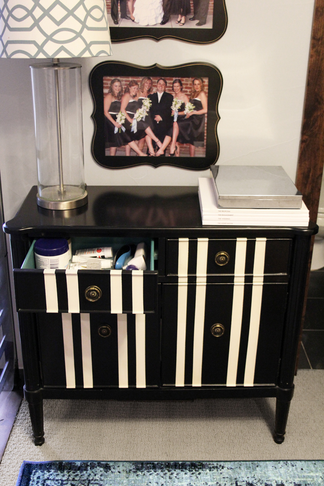 Black and white striped cabinet with shelf liner in drawers