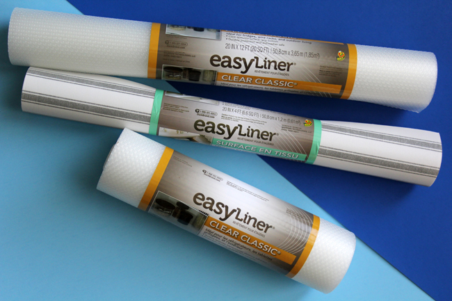 three rolls of Duck Brand easy shelf liner