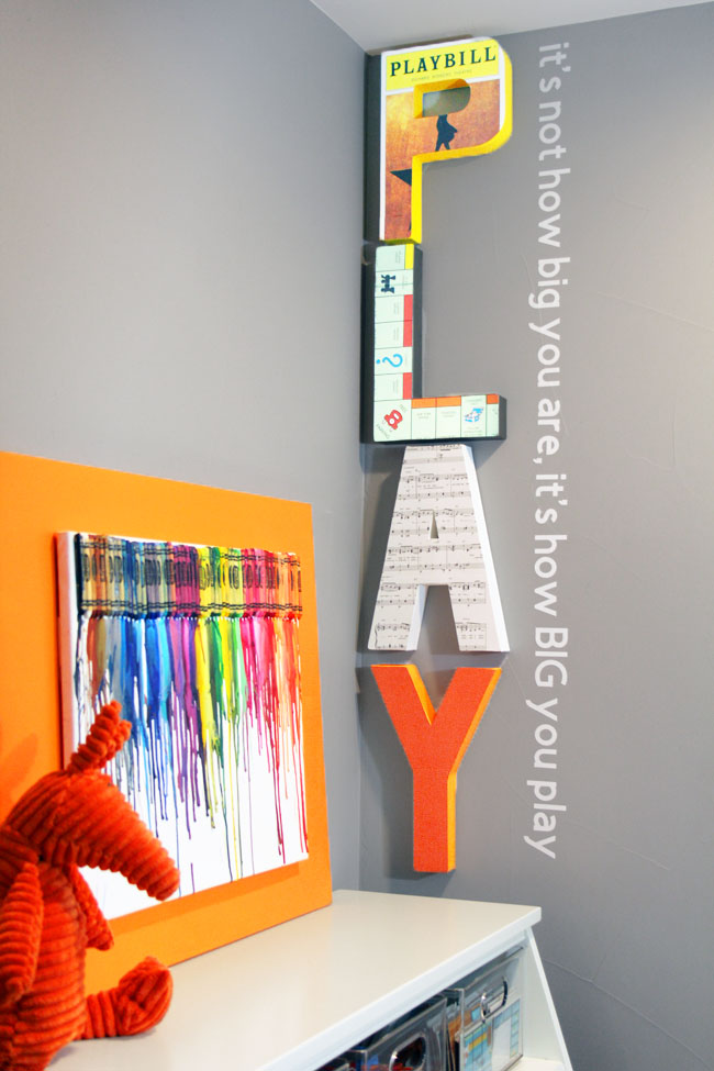 Large paper mache PLAY letters and vinyl wall quote about play from John Wooden