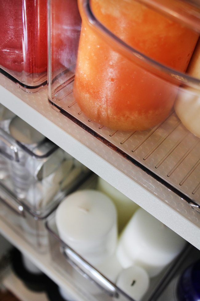 Shelf liner under acrylic bins on shelves