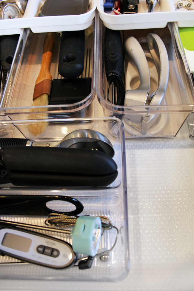 clear shelf liner below kitchen drawer organizing bins