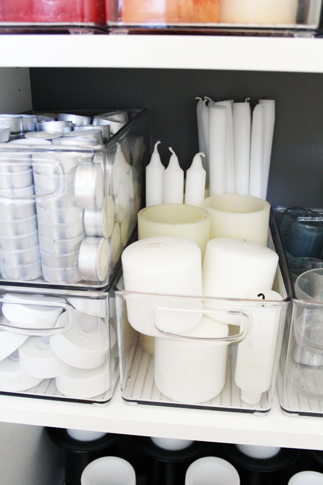 Votive candle storage in clear stacking bins
